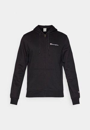 Black zip-up hoodie made of cotton. Features a drawstring hood, two front pockets, and a small Champion logo on the left chest.