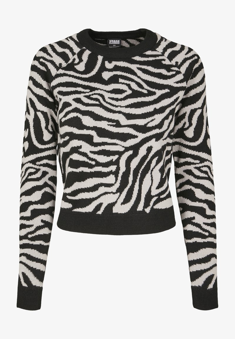 Gestreifter Pullover in Schwarz und Weiß mit Zebramuster, aus gestricktem Material, rundem Ausschnitt und gerippten Bündchen und Saum. Kürzere Passform.