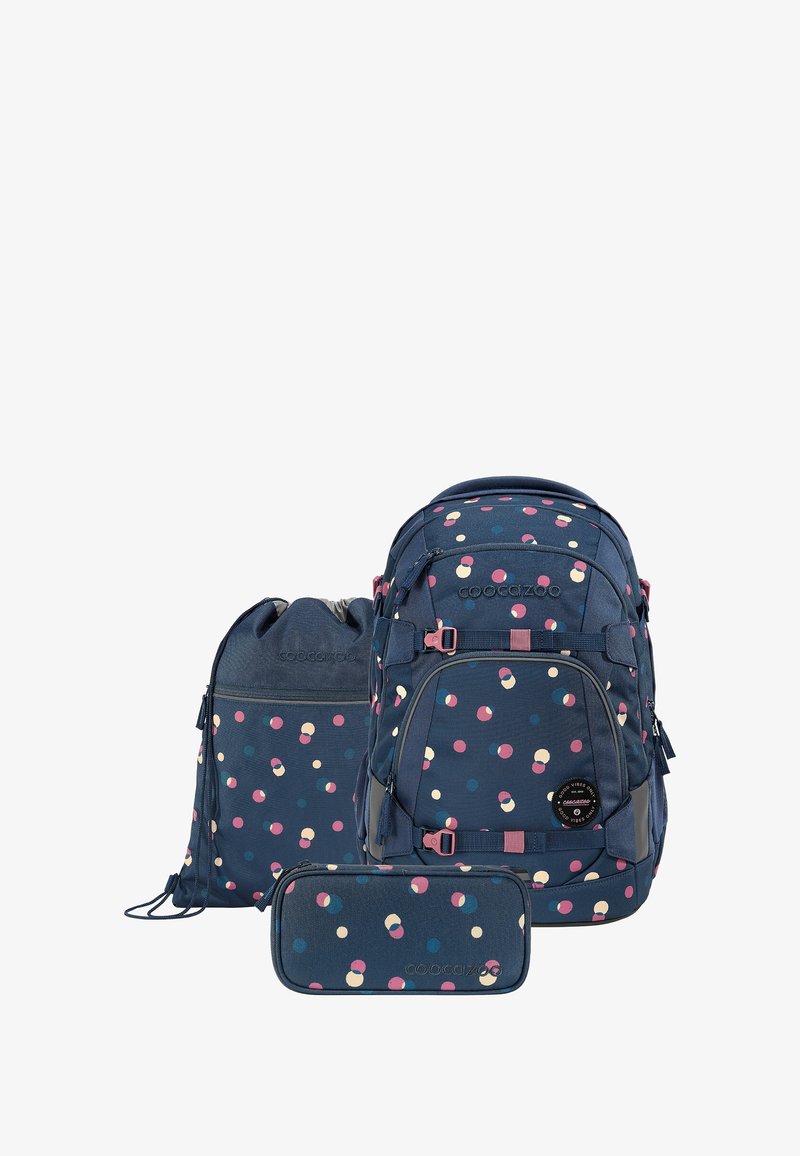 Backpack set with a navy fabric featuring a multicolored polka dot pattern. Includes a main backpack, a drawstring bag, and a pencil case.