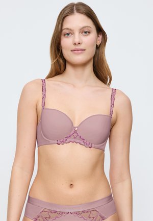 Beha in zacht mauve met gladde cupscups en bloemenkant accenten. Voorzien van verstelbare bandjes en subtiele golvende randen voor ontwerpdetaillering.