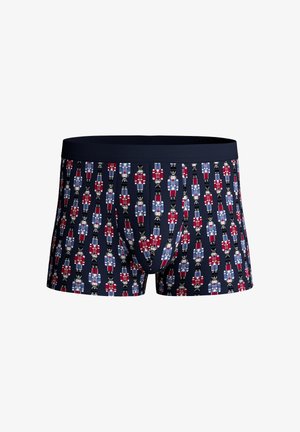 Boxershorts in marineblauw met een herhaald notenkrakerpatroon in rood, wit en blauw. Zachte stof met een nauwsluitende pasvorm en een elastische tailleband.