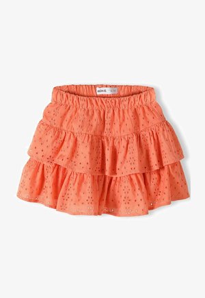 Pomarańczowa spódnica o warstwowym kroju z falbanami, wykonana z lekkiego materiału, z wycięciami typu eyelet i elastycznym pasem dla wygody.