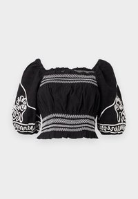 Svart av skuldrene bluse med pufferm, med hvite broderte mønstre og teksturert stoff, samlet midje og elastiske mansjetter.