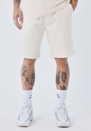 ESSENTIALS - Pantalones deportivos - craie