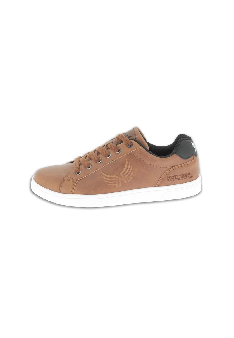 Tan leather sneaker with white rubber sole, round toe, and six eyelets. Features embossed logo and wing design on the side. Black heel accent.