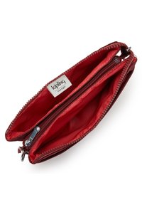 Kipling RIRI - Axelremsväska - flaring rust