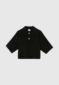 Polo en tricot noir à manches courtes, avec un col classique et une fermeture à trois boutons ornée d'un motif floral. Ourlet et poignets côtelés.