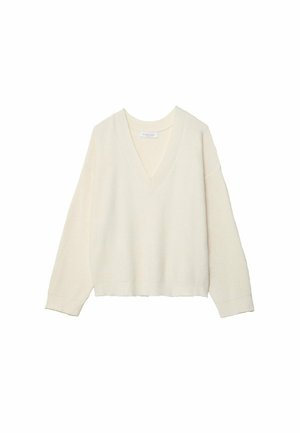 Pull crème à col en V avec texture côtelée, coupe ample et manches longues. Matériau doux, longueur cropped, présentant un motif de tricot subtil.
