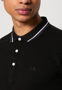 Lindbergh CONTRAST PIPING - Bluză polo - black