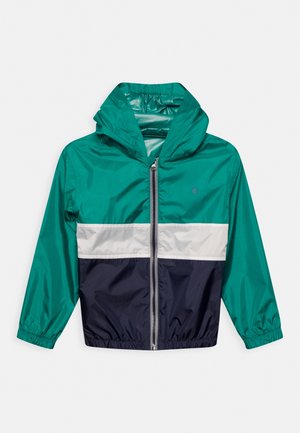 Groene, navy en witte kleurgeblokte windbreakerjas met een capuchon, elastische manchetten en een voorkant met rits. Soepele, lichte stof.