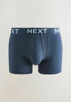 Boxers ajustés pour hommes en bleu marine, fabriqués en tissu doux, avec une ceinture à logo "NEXT" bleu et une conception de poche avant qui offre un bon maintien.