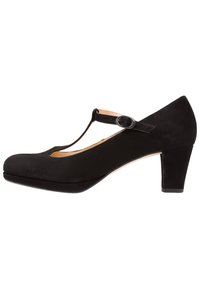 Zapato de tacón T en ante negro con punta redonda y tacón medio. Cuenta con una única correa ajustable cerca del tobillo y un interior suave.