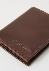 Brown leather wallet with embossed "Barbour" logo, smooth texture, and contrasting stitching along the edges. Compact rectangular shape.
