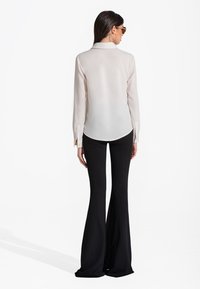 SAX35TH by Alicja Czarniecka WIDE - Hlače - black