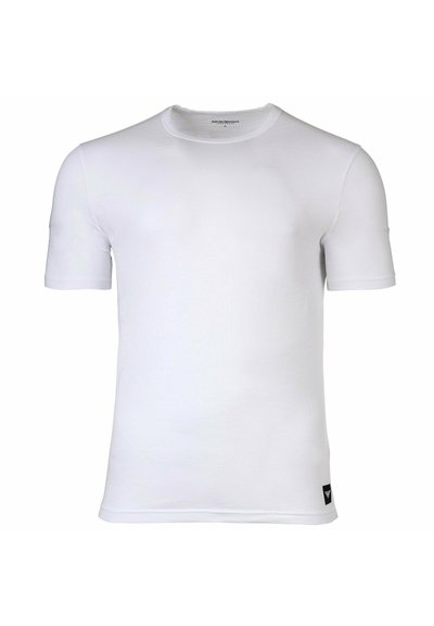 T-shirt bianco a maniche corte realizzato in tessuto morbido, con scollatura rotonda e una piccola etichetta con logo sul bordo inferiore sinistro.