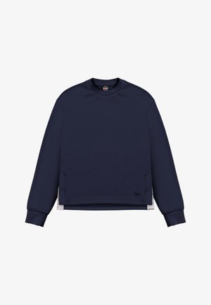 Granatowa bluza z długim rękawem, okrągłym dekoltem, ściągaczami na mankietach, bocznymi rozcięciami oraz małym okrągłym logo przy brzegu na białym tle.