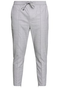 Szare spodnie dresowe w kratę z elastycznym pasem, regulowanym sznurkiem, bocznymi kieszeniami i ściągaczami przy nogawkach. Miękka faktura i dopasowany krój.