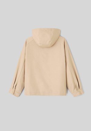 Veste beige à capuche avec manches longues, poignets à boutons et ourlet droit, vue de dos sur un fond gris.