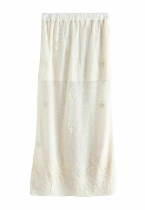 Valge varjundiga läbipaistev seelik, millel on peen palmižeste tikand ja kogutud elastne vöökoht, kujutatud ühevärvilisel valgel taustal.