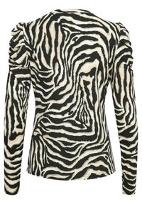 Langarmoberteil mit einem schwarz-cremefarbenen Zebra-Druck, mit gerafften Details an den Schultern und einer glatten, elastischen Textur.