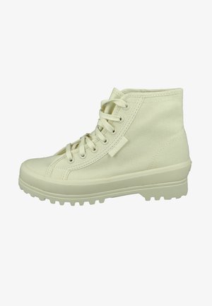 Ecrufarbene, knöchelhohe Schnürstiefel aus strukturiertem Canvas mit einer Gummisohle für besseren Halt und verstärkter Zehenkappe, ausgestattet mit Metallösen.
