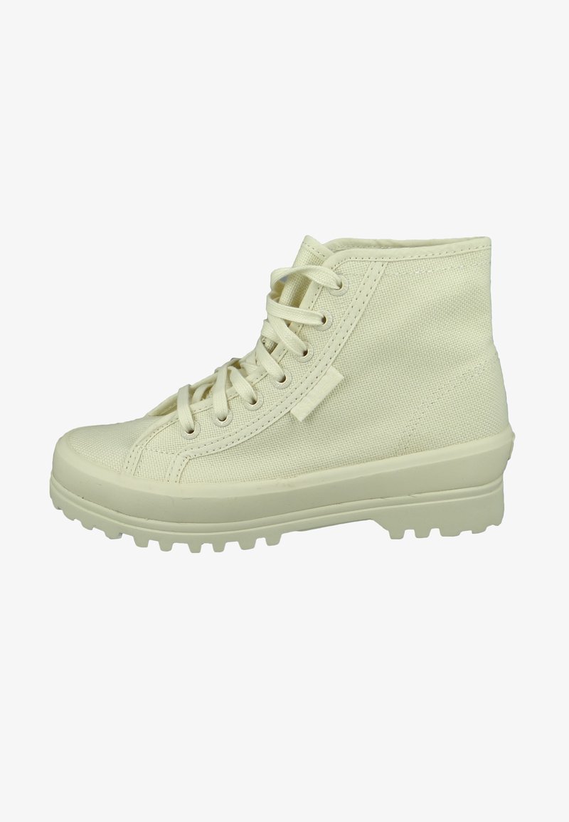 Cream-colored, mid-top lace-up boots made of textured canvas with a rubber traction sole and reinforced toe, featuring metal eyelets.