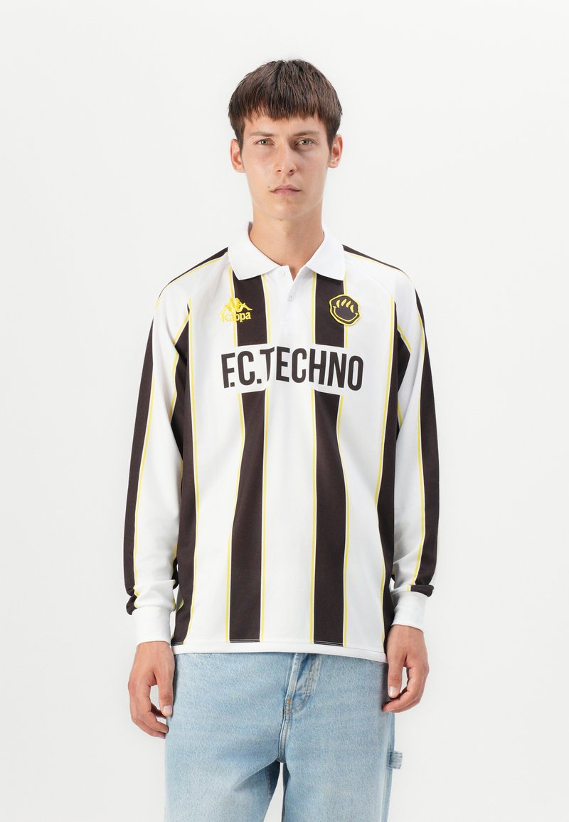 Langermet jersey i hvit, svart og gul stripete design. Har krage, brodert logo og teksten "F.C.TECHNO" foran.