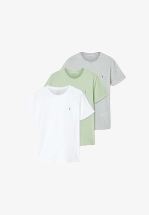 Three crew-neck t-shirts in white, light green, and grey, each with a small embroidered logo on the left chest.