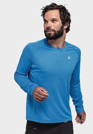 Langärmliges Sportshirt in leuchtendem Blau, aus strukturiertem Synthetikmaterial mit einer enganliegenden Passform und Raglanärmeln.