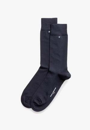 Calzini blu navy con motivo a trama, polsino a coste e punta rinforzata. Logo del marchio stampato sul lato in bianco.