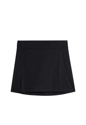 Svart sportkjol i elastisk tyg, med en platt midja och sidofickor för rörlighet. Slät textur och minimalistisk design.