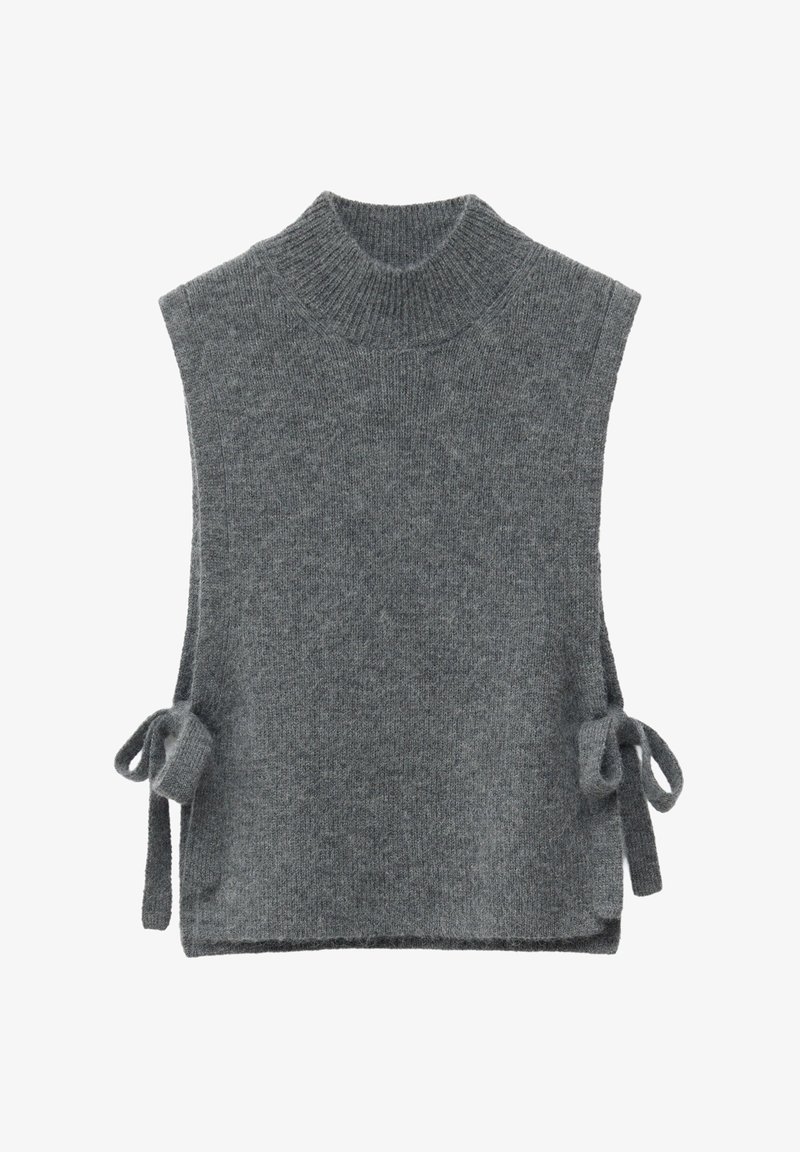 Gray sleeveless knit turtleneck with side ties. Features a soft texture and a relaxed fit, designed for layering in cooler weather.