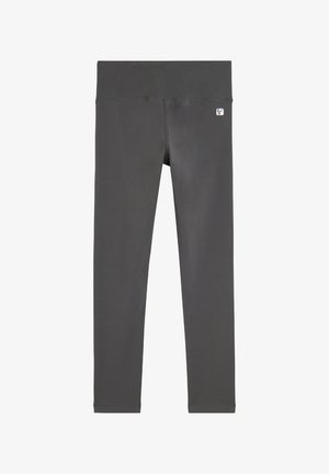 Leggings taille haute ajustés en gris foncé, fabriqués dans un tissu extensible. Dispose d'une petite étiquette avec logo à la taille, texture lisse et sans motifs.