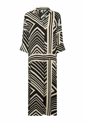 Melna un bēša krekla kleita ar ģeometriskiem rakstiem, ar V-veida kakla izgriezumu, trīs ceturtdaļu piedurknēm un brīvu piegriezumu.