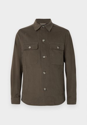 Dark olive green shirt jacket made of smooth fabric, featuring a collar, front button closure, and dual chest pockets with matching buttons.