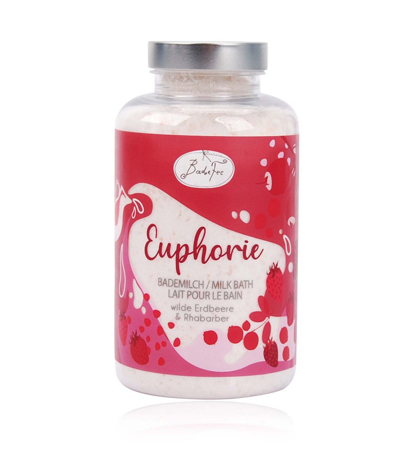 Bottle of Euphorie milk bath powder with wild strawberry and rhubarb scent, featuring red and pink label design and silver cap.