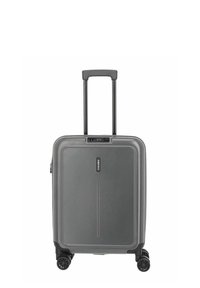 Valise rigide grise avec poignée rétractable, quatre roues pivotantes et serrure à combinaison intégrée sur fond blanc.