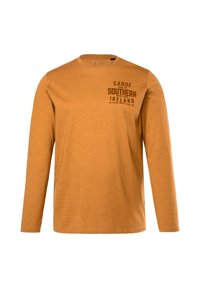 Langsleeve t-shirt in gouden oranje katoen, met een zwarte bedrukte opdruk "Canoe Southern Ireland" op de voorkant, ronde crew hals.