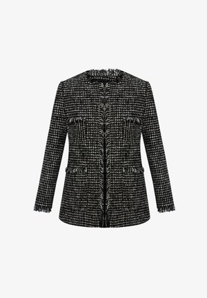 Veste en tweed noir et blanc avec une finition texturée, des bords effilochés, un col rond et deux poches avant. Ajustement cintré, manches longues.