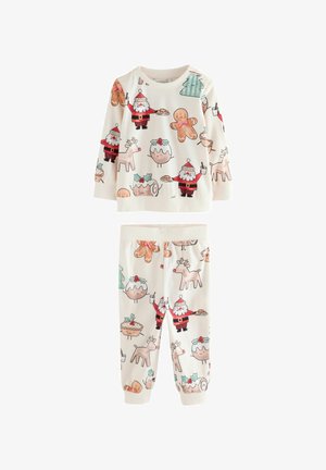 Twee-delig pyjama set voor kinderen in zachte, crème kleurige stof. Kenmerkt feestelijke prints van de kerstman, peperkoekkoekjes en rendieren.