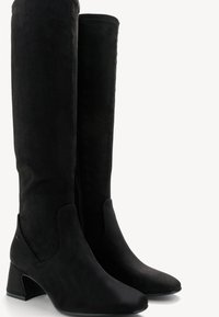 Black suede knee-high boots with a pointed toe and a block heel. Features a side zipper and smooth texture. Simple and sleek design.