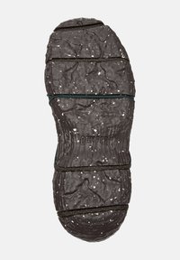 Shoe sole in dark brown rubber with textured surface, featuring green laces and white speckles. Marked with "CAMPER" and size 38.