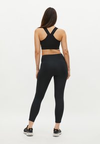 Röhnisch KAY HIGH WAIST T - Leggings - black black