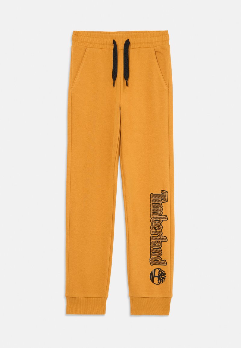 Heren gele sweatpants met zwarte trekkoorden en zijzakken. Voorzien van een zwart "Timberland" logo en boomembleem op het linkerpijpkant.
