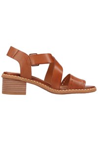 Brown leather sandal with cross straps, side buckle, and a textured mid-heel. Braided detailing along the sole edge. Open-toe design.