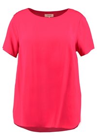 Blusa rosa a maniche corte con scollo rotondo e vestibilità comoda. Tessuto liscio con orlo posteriore leggermente più lungo.