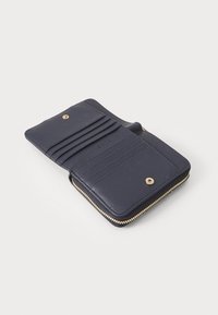 Navy leather wallet with a zip closure, six card slots, a snap button, and gold-tone hardware. Smooth texture and simple design.