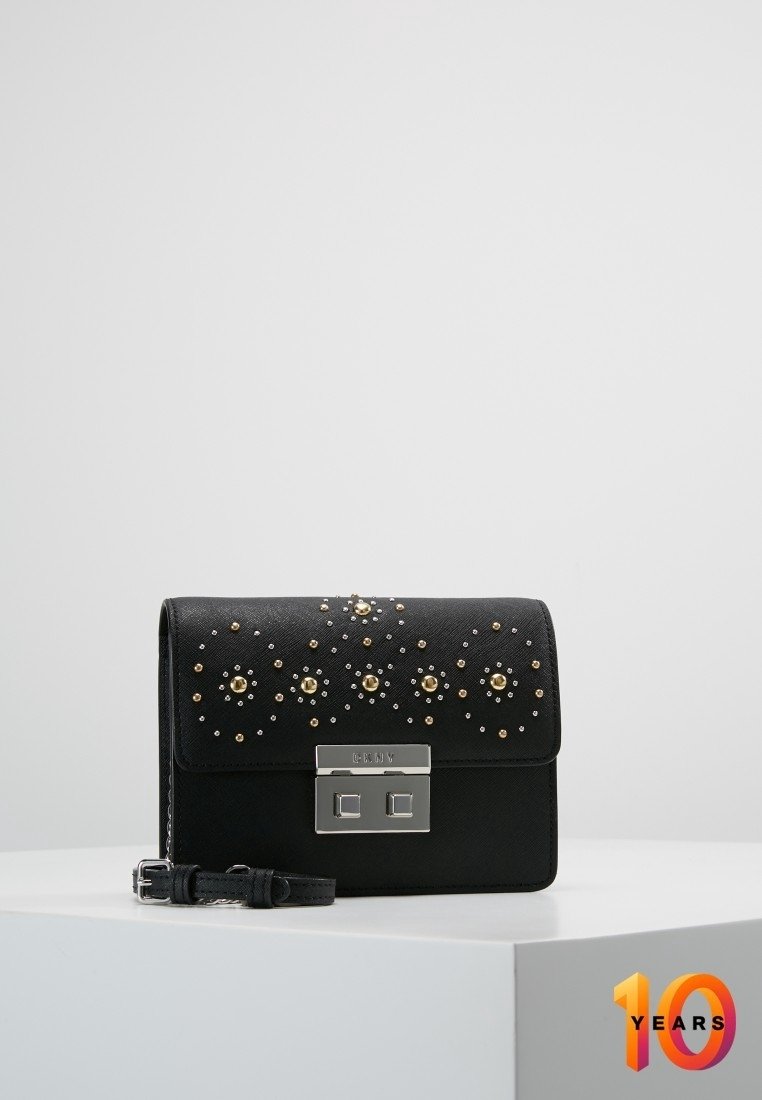 Black rectangular handbag made of textured material, featuring gold and silver studs on the front, with a metallic clasp and detachable strap.