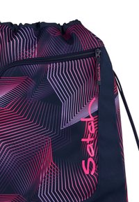 Drawstring backpack made of durable fabric, featuring a geometric pattern in shades of purple and pink, with a zippered front pocket.