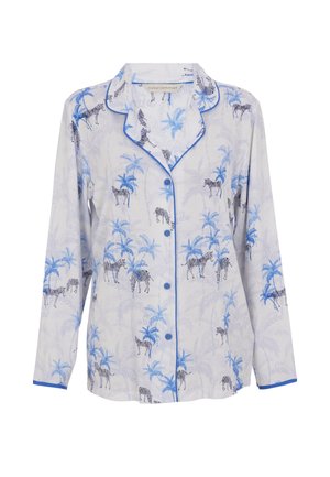 Witte pyjama top met een blauw zebra- en palmboomprint. Voorzien van een knoopsluiting aan de voorkant, een kraag en blauwe biesjes langs de randen. Lange mouwen.
